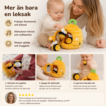 Sensorisk leksak i form av en liten bikupa med skramlande bin, pip och spegel